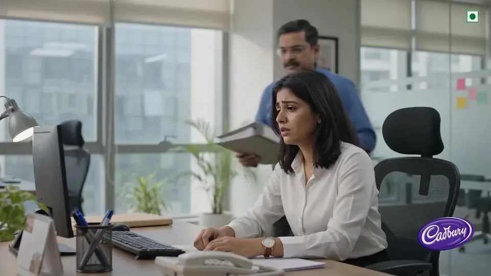 A tired office worker at her desk