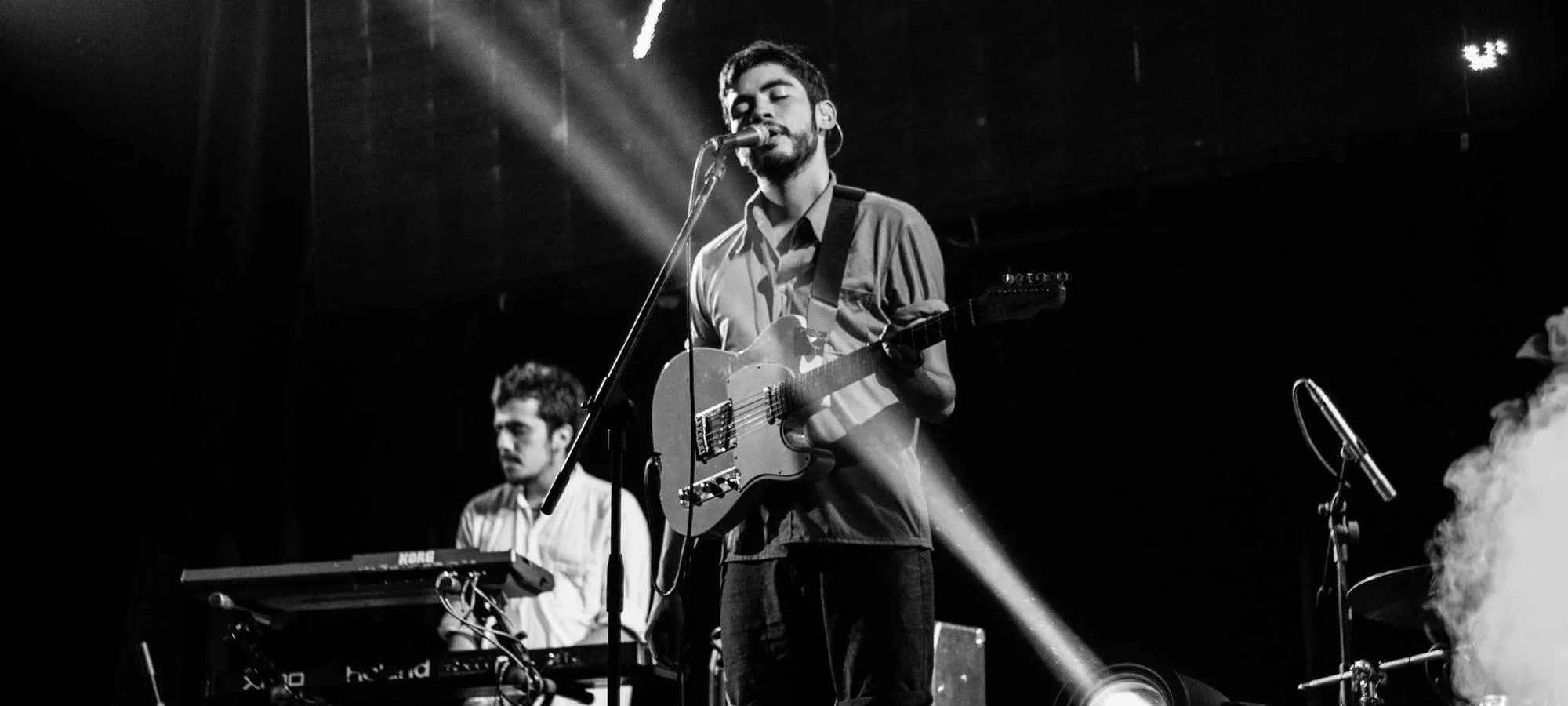 Band performing under a spotlight