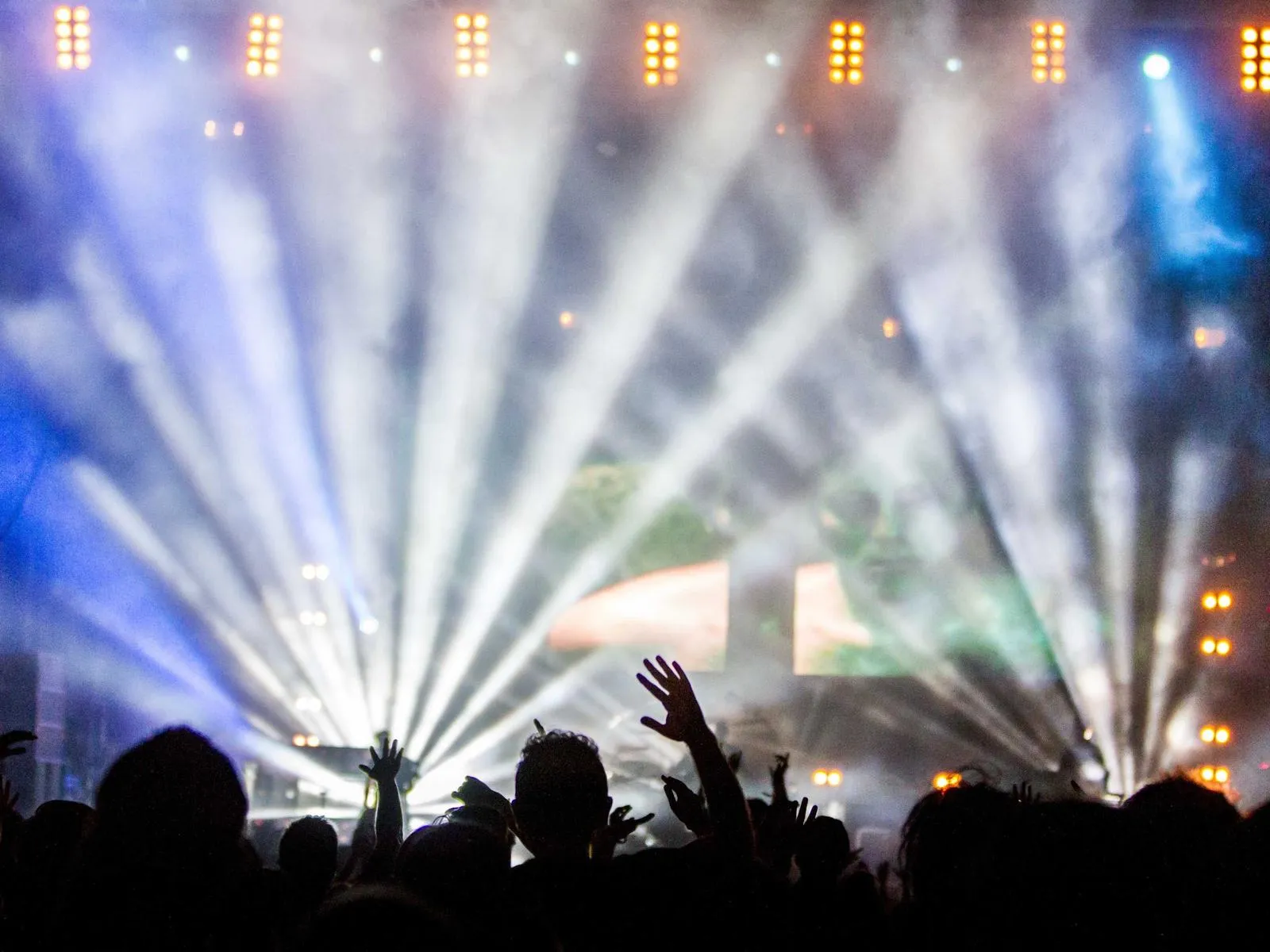 Concert crowd under stage lights
