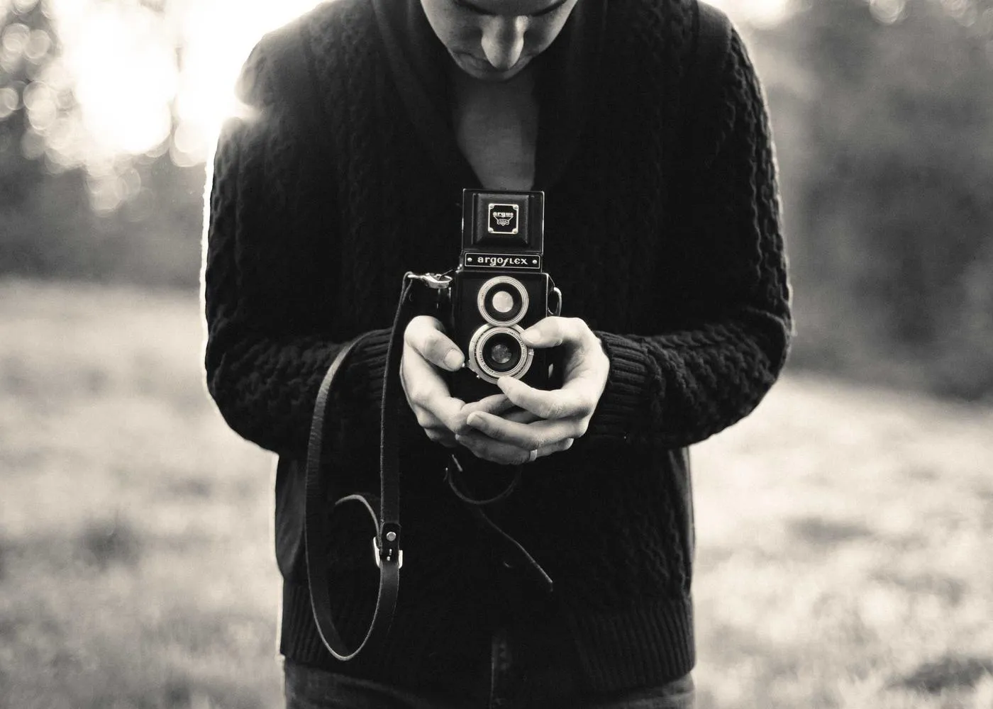 Person holding a vintage camera